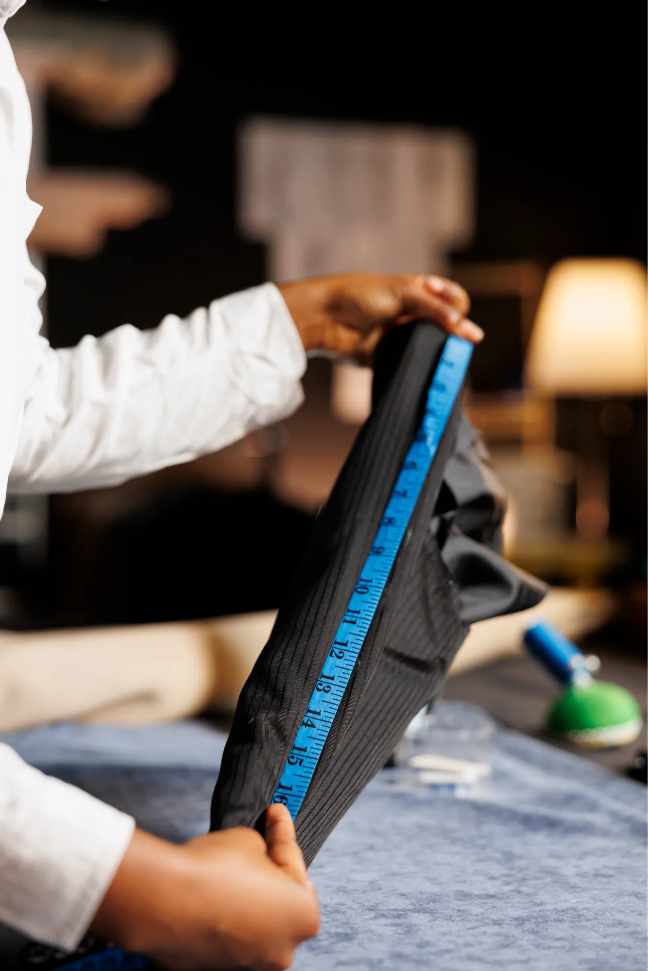 close-up-seamstress-measuring-garment1